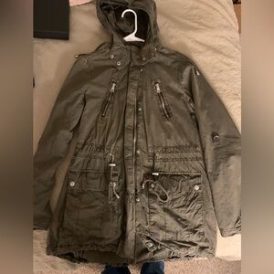 Levi’s dark green jacket.